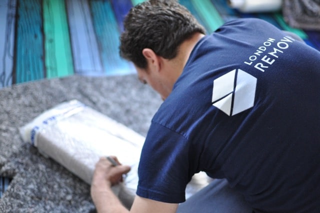 London Removals man packing a box
