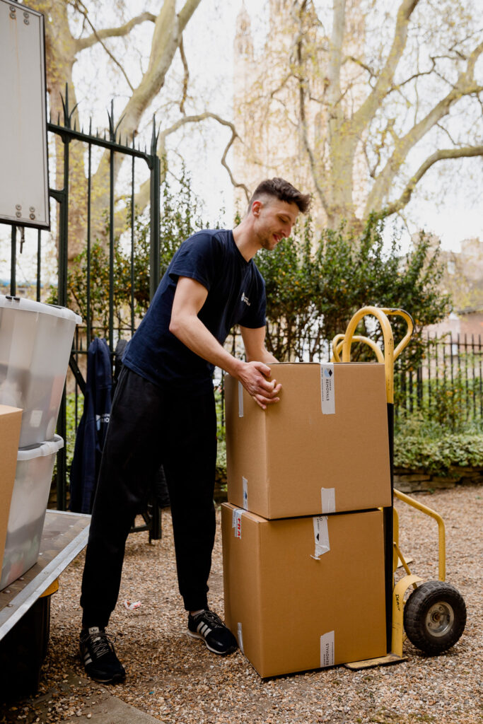 A London removals man moving boxes